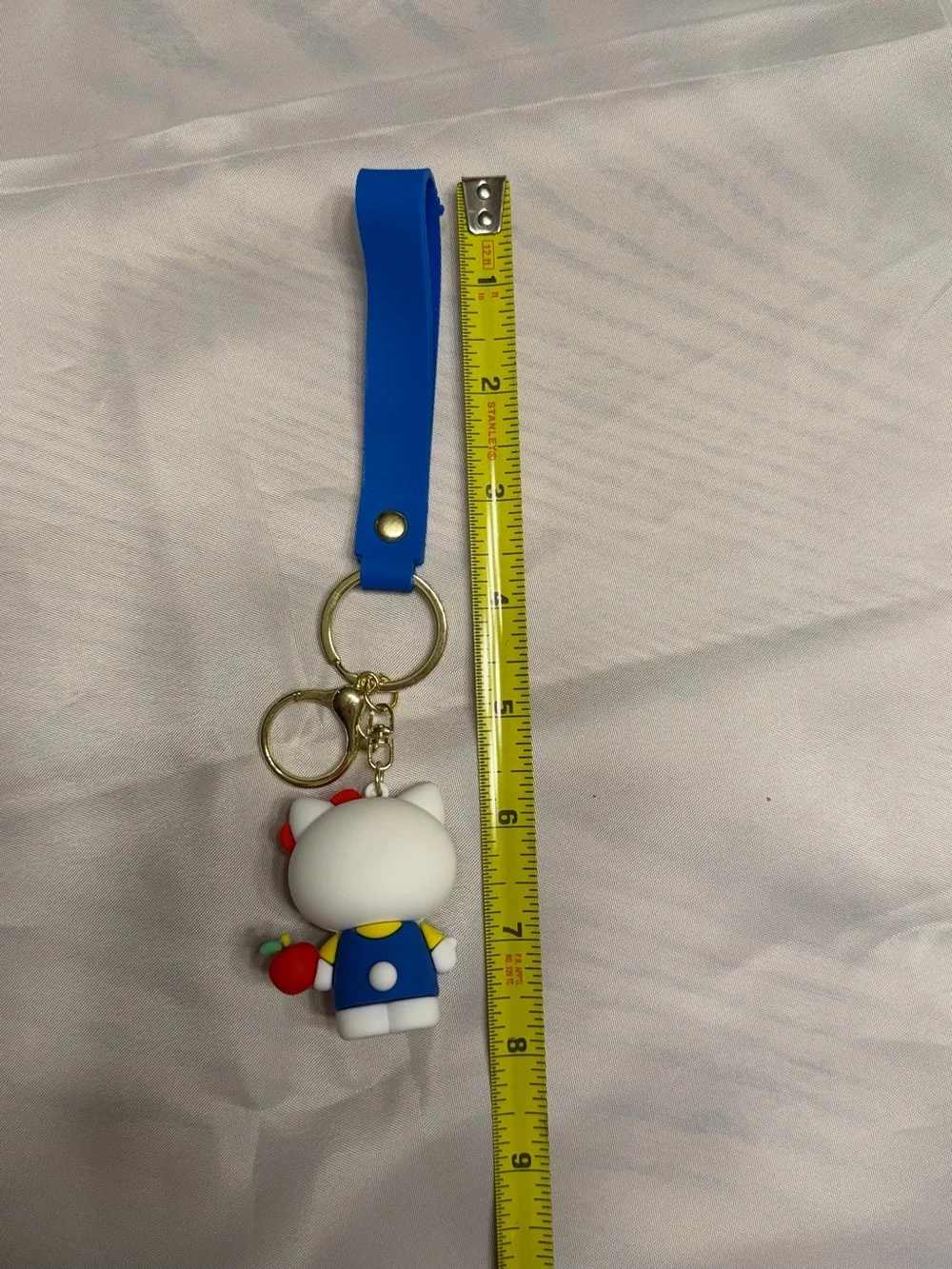 Hello Kitty White Figure Keychain/Wristlet with Red Bow and Blue Outfit & apple